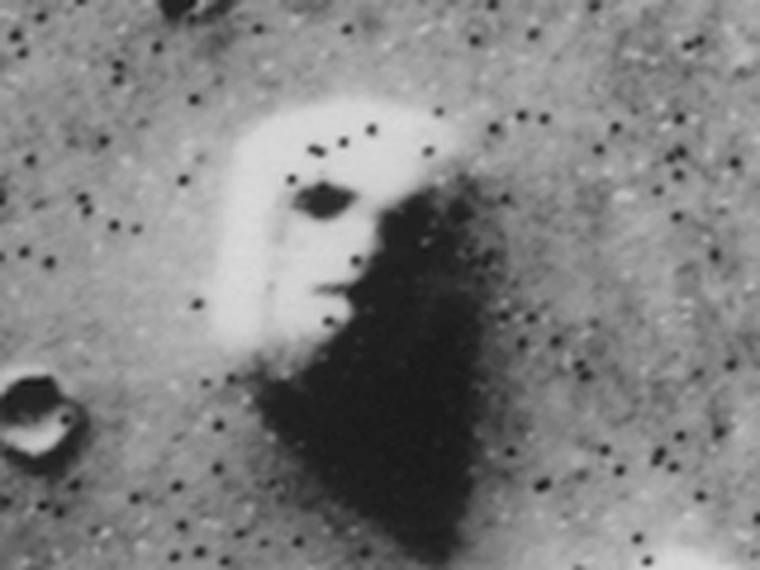 The Face, enlarged from NASA's release of Viking 1 frame 35A72 (July 25, 1976). The black dots are calibration marks and data dropouts, not features.