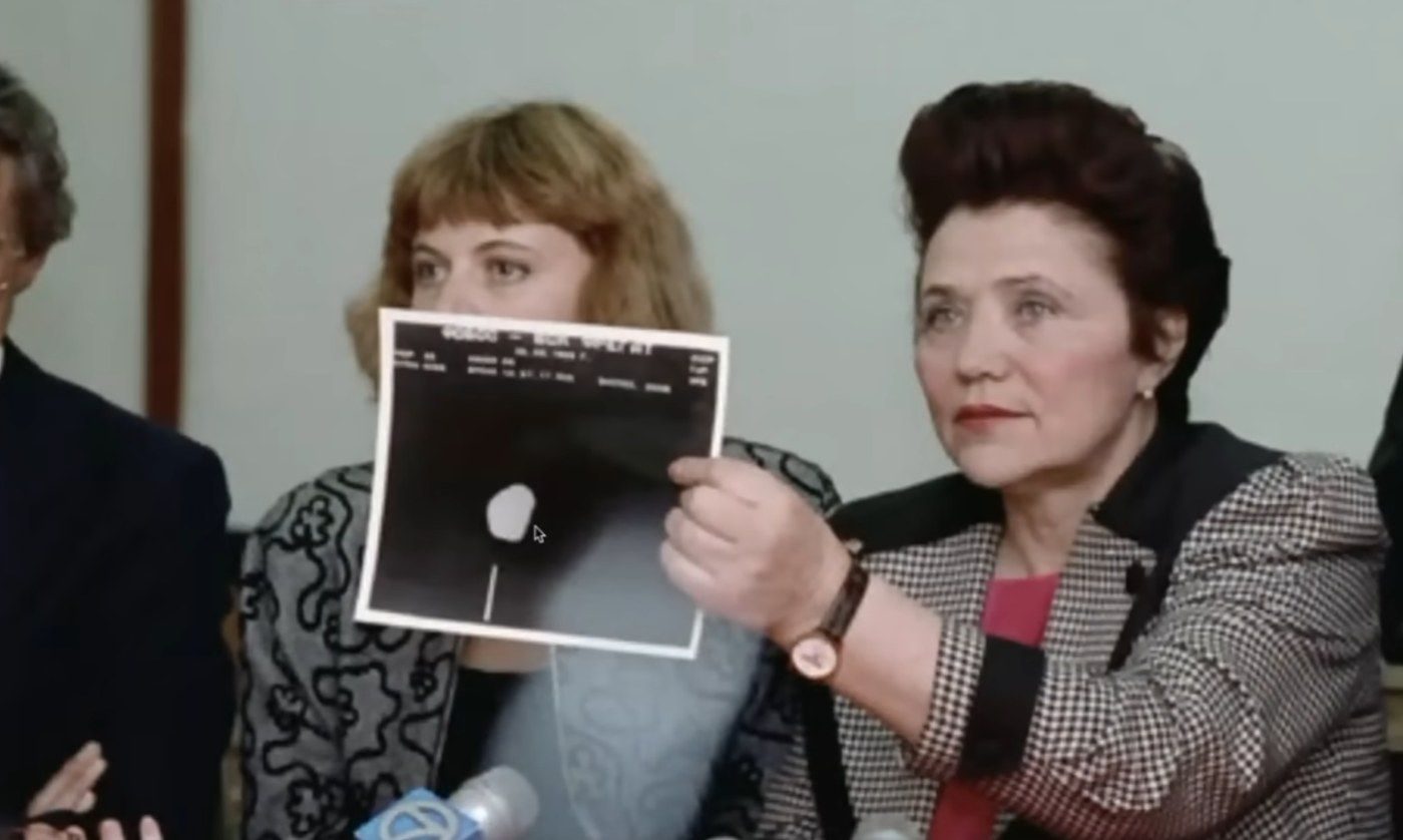 Reality Check with Max Derakhshani, 11:18. Marina Popovich holding the Phobos 2 photo.