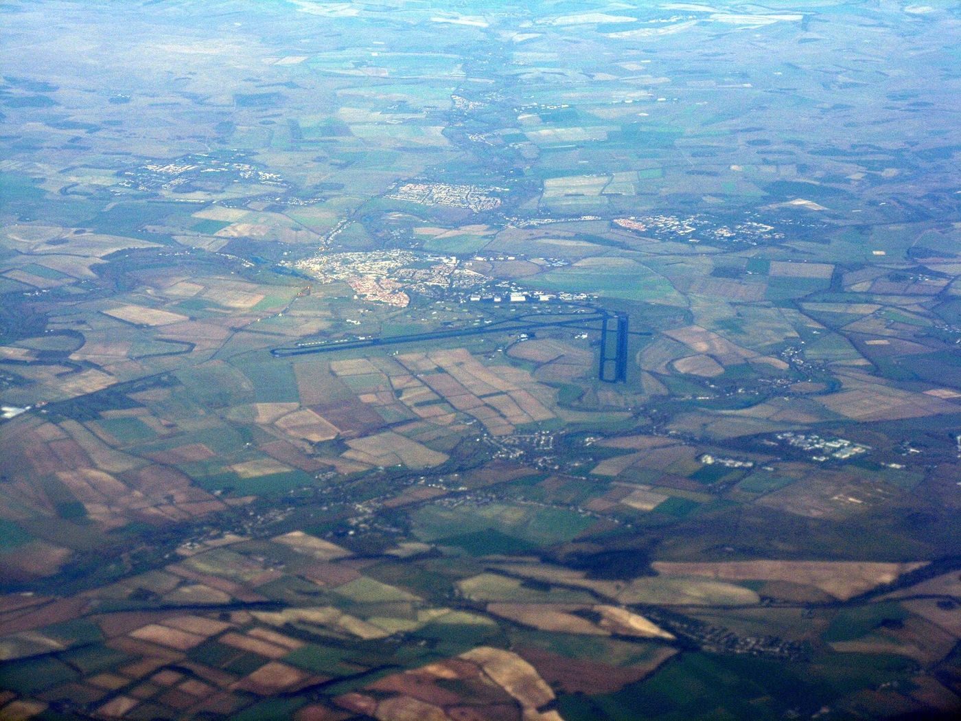 MoD Boscombe Down airfield and the town of Amesbury, Wiltshire, seen from the air (January 2013).