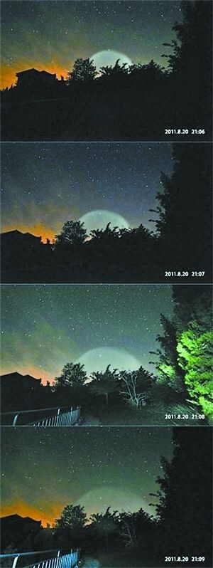 Event photos: four frames timed 21:06 to 21:09 on 20 Aug 2011 by Ma Jin, engineer at the National Astronomical Observatories, from the Xinglong observing station, showing the light sphere swelling above the horizon and fading. Published by China News Service on 30 Aug 2011.