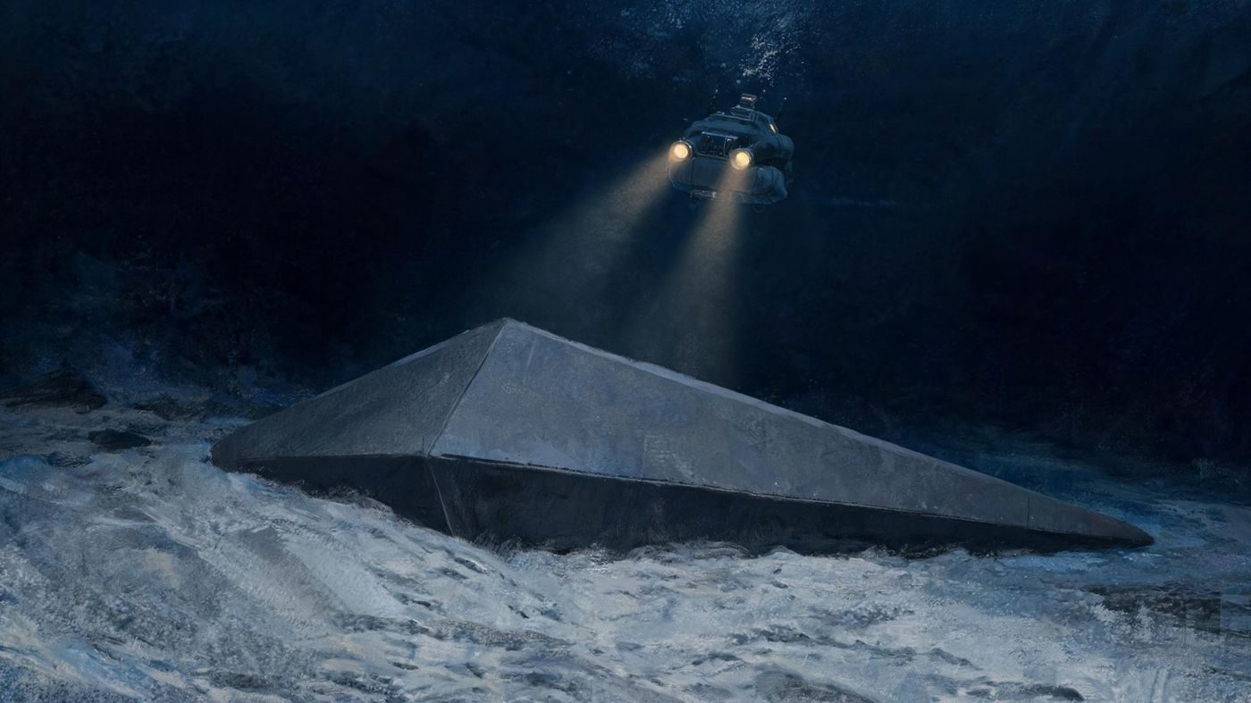 A charcoal-grey triangle on the North Atlantic seabed lit by a rescue submersible, as the DSRV crew member describes it (1991).