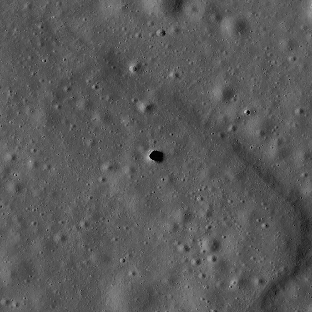 Context image: LRO Narrow Angle Camera view of the Marius Hills pit, a skylight into a possible lava tube in the region where Chappaz et al. (2017) found GRAIL evidence for empty tubes. It is not the 60 km tube described, which has not been identified.