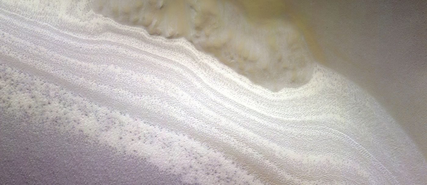 Layers of ice and dust in the south polar layered deposits of Mars, seen by the CaSSIS camera on ESA's Trace Gas Orbiter (2018). The radar echo was found about 1.5 km beneath deposits like these.