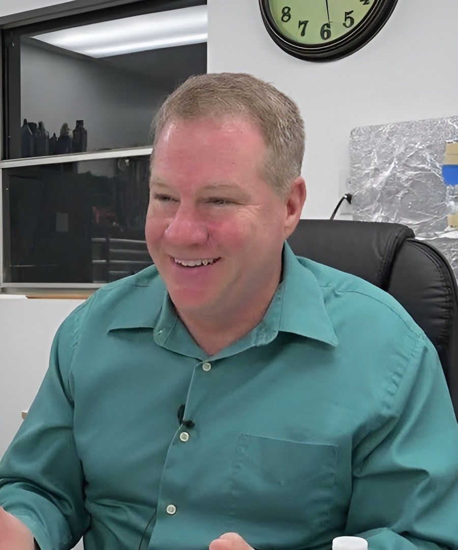 Dr Charles Buhler, co-founder of Exodus Propulsion Technologies and former NASA Kennedy Space Center electrostatics engineer, in his lab during a 2024 interview (cut from the video thumbnail).