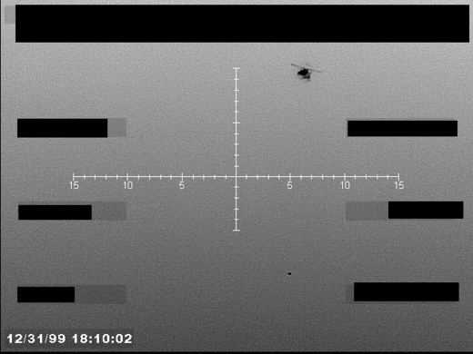 FBI Photo B7, Helicopter Plus Circular Object (FBI still B7)