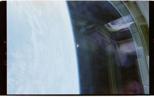 STS-80 Rotating Object Over Earth, 1996
