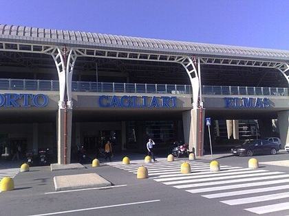 Context: the modern terminal of Cagliari-Elmas airport, Sardinia (undated, 2000s). The airfield was shared with the military in 1977.