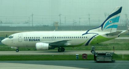 Context, not the event: an Air Busan Boeing 737 taxiing at Gimhae International Airport, the joint civil and ROK Air Force (5th Air Mobility Wing) airfield closed from about 21:14 to 22:00 on 19 May 2026. Photo taken 10 June 2011.