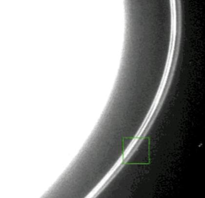 A kink tracked along the F ring (two video grabs)